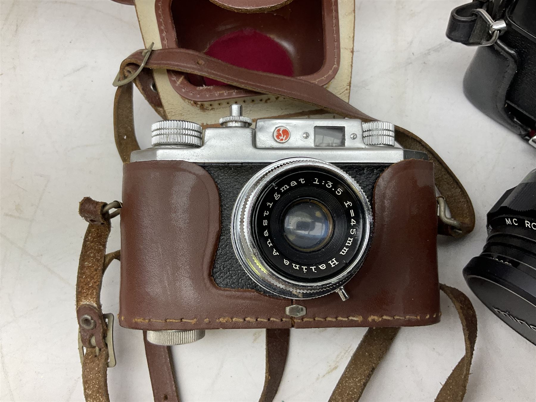 Minolta SRT101 camera, together with Halina camera, Fujifilm DX-8, Canon digital IXUS 1001S and other cameras and accessories 