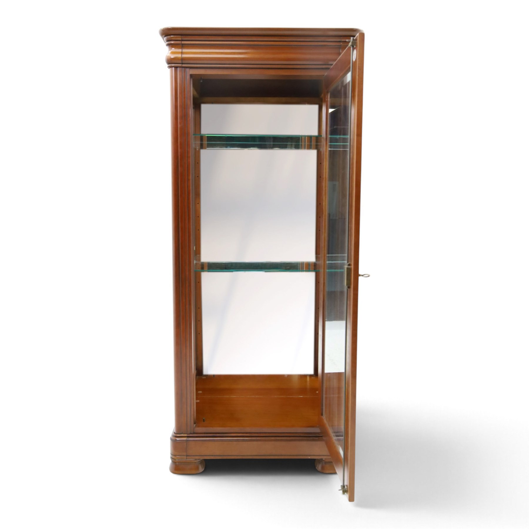 Barker & Stonehouse - cherrywood glazed cabinet, moulded projecting cornice glazed panels to the front and sides, mirrored back with adjustable glass shelves, moulded plinth base above short bun feet