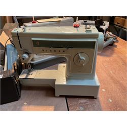 Two Singer sewing machines, model numbers 527 and 457, together with various Singer sewing machine parts, and a selection of sewing related accessories, to include threads, sewing needles, etc.
