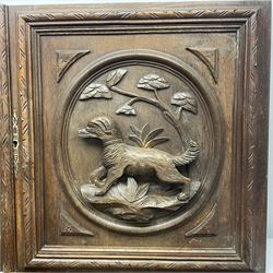 Pair of oak furniture door panels, carved in relief with a fox to one and a hound to the other, together with a pair of smaller oak panels, carved in relief with a hare to one and a grouse to the other, doors W63.cm x H62cm, panels W43cm x H60cm