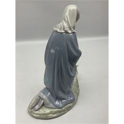 Lladro figure, Holy Night, modelled as Mary kneeling over baby Jesus, sculpted by Vincente Martinez, with original box, no 5796, year issued 1991, year retired 1994, H22cm