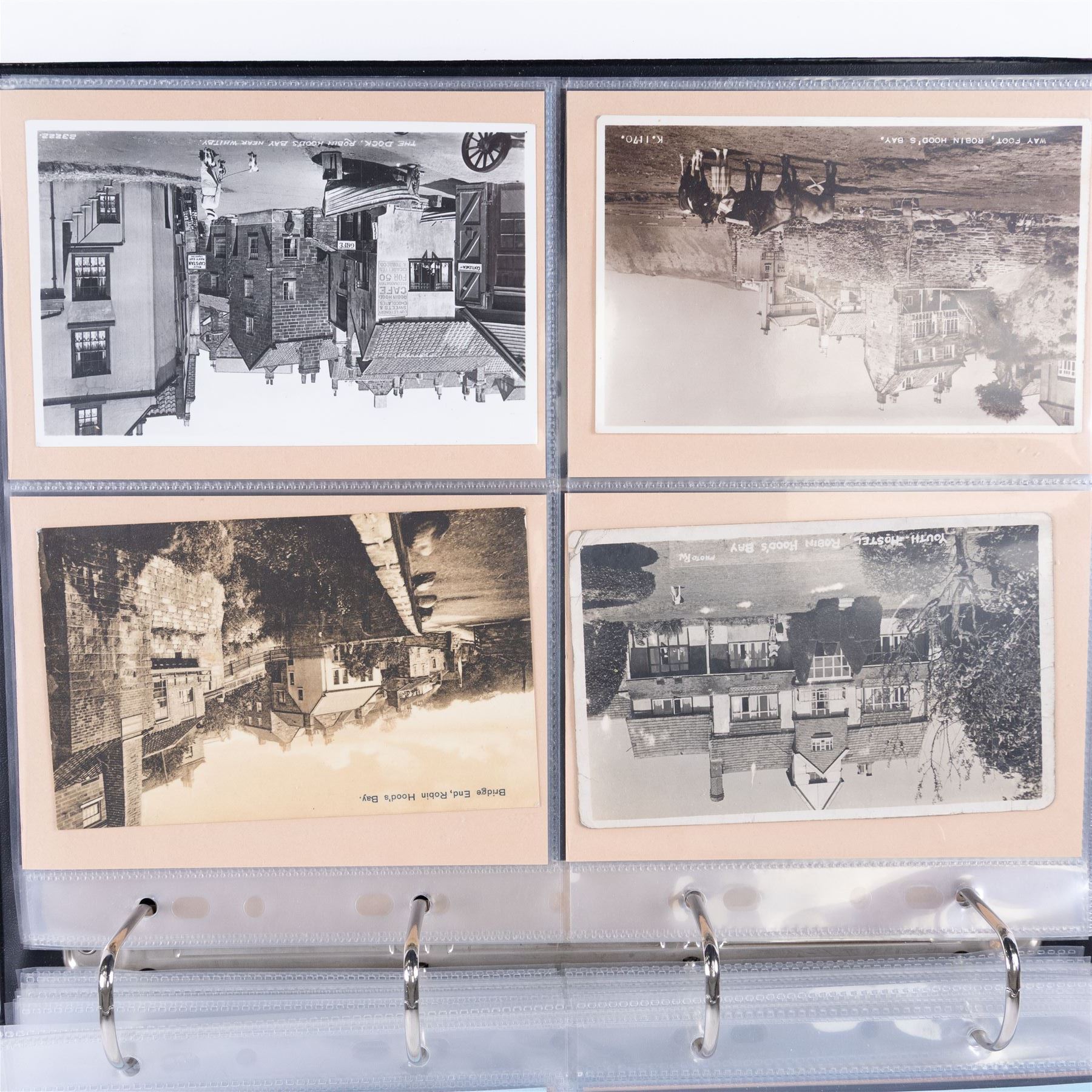 Four-hundred and twelve early 20th century Whitby District view real photographic postcards, including a selection from the Whitby Coast (176), starting at Staithes and Runswick Bay down to Robin Hoods Bay and a selection from the Valley of the River Esk (236), including Ruswarp, Rig Mill, Sneaton, Sleights, Grosmont, Egton, Glaisdale, Danby, Castleton and Goathland, all housed within two postcard albums