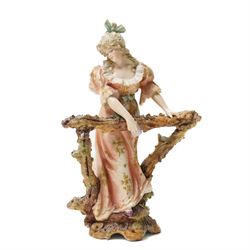 Collection of German and continental porcelain figures, including a figure of Juno with peacock, two figures feeding birds on benches, cherub candlesticks, and others