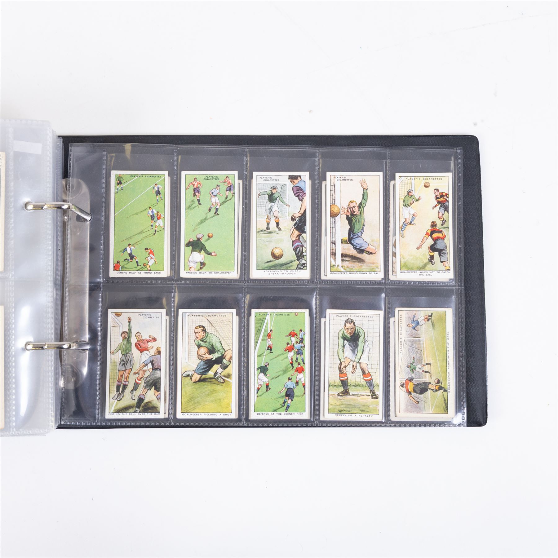 Collection of Edwardian and later Football related trading and cigarette cards, including forty-nine of fifty 1906 Ogden's Football Club Colours, 1922 PALS Footall series, ninety of one hundred 1925 Gallaher Famous Footballers, complete set of forty-four 1926 Ogden's Captains of Association Football Clubs and Colours, complete set of fifty 1927 Players Football Caricatures by MAC,  complete set of fifty 1927 Players Football Caricatures by RIP,  complete set of fifty 1930 Players Association Cup Winners, complete set of 50 1933 Ogdens AFC Nicknames etc, housed in brown cigarette card album