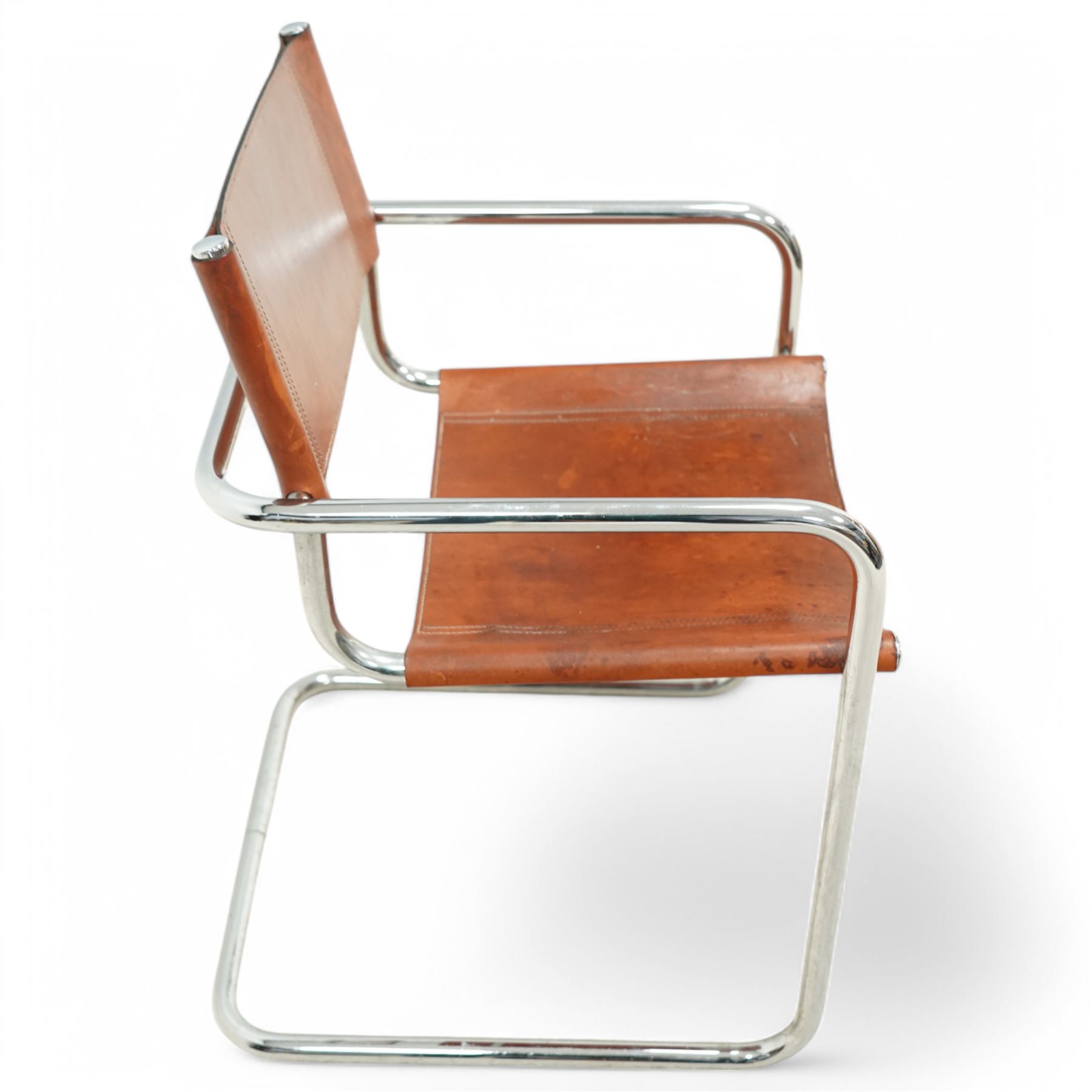 Pieff - circa. 1970s chrome framed armchair with black leather upholstered cushions (W60cm); together with a mid-20th century chrome framed chair in the manner of Mart Stam (W55cm)