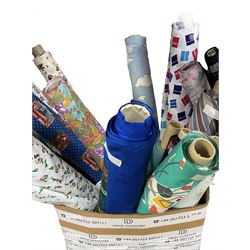 Haberdashery Shop Stock: Various rolls of fabric including metallic printed stage satin, abstract and geometric patterns, children's and festive fabric, and others (qty) in two boxes