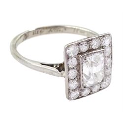 Art Deco platinum and white gold milgrain set diamond ring, circa 1920's, the central cushion cut diamond of approx 0.90 carat, with old cut diamond surround, total diamond weight approx 1.10 carat