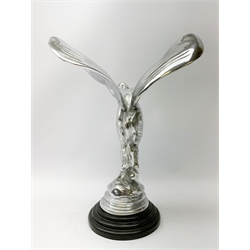  A cast Rolls Royce Spirit of Ecstasy car mascot, raised upon a circular stepped wooden base, H36cm.   