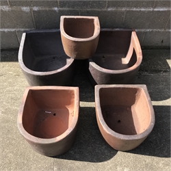  Two large 'D' shaped rustic frost proof pots (W51cm, H33cm, D61cm), two similar medium 'D' shaped frost proof pots (W43cm, H26cm, D46cm) and a small pot (W32cm, H21cm, D35cm) (5)  