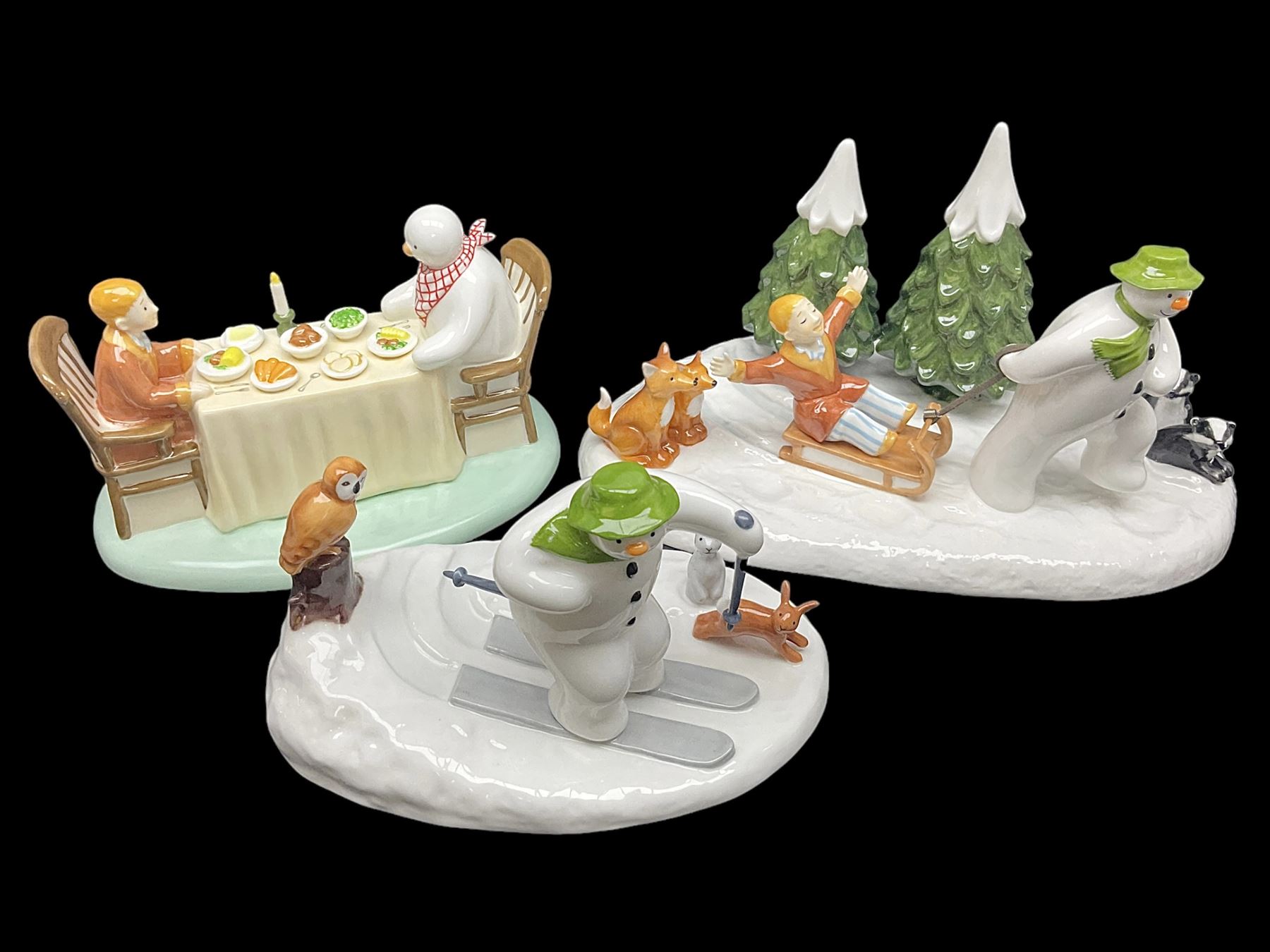 Three Coalport Characters The Snowman figures, comprising Dinner for Two, Off Piste and Winter Fun, all with certificates and original boxes 