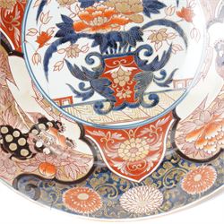 Japanese 18th century Edo period Imari porcelain charger, painted with a central peony in vase within a border of kiku and spotted shi-shi, D54cm 
