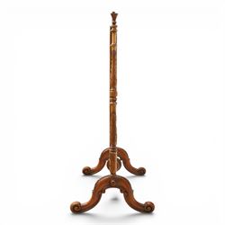 Two Victorian fire screens, comprising mahogany pole screen with glazed floral woolwork panel on turned support and triform base (H 142cm, W 48cm); and a larger carved walnut tapestry fire screen, glazed panel depicting a domestic interior scene, scroll carved cresting, barley twist uprights and turned stretcher base (H 75cm, W 49cm)