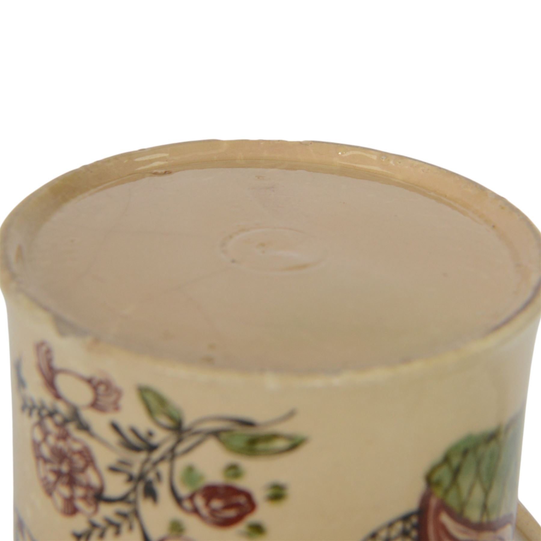 Late 18th century creamware documentary tankard, of cylindrical form with curbed handle, inscribed 'John & Dorothy Stockel 1783', above a floral spray and flanked by a seated female figure to one side, and bull and house to the other, H16.5cm