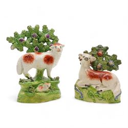 Early 19th century Staffordshire pearlware group by Ralph Salt, modelled as a sheep and lamb before a flowering bocage, impressed 'Salt' verso, H16cm, pair of similar Staffordshire pearlware sheep and ram and poodle group, numbered 198 beneath, with 'Max Bilbe Collection' label (4)