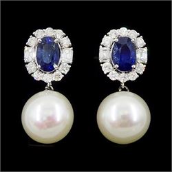 Pair of 18ct white gold sapphire, diamond and pearl pendant stud earrings, the oval cut sapphires, round brilliant cut and emerald cut diamond clusters, suspending a culture white / pink pearl, stamped 18K, total sapphire weight approx 2.15 carat, total diamond weight approx 1.00 carat