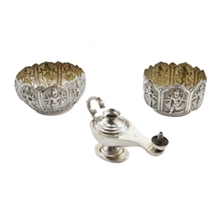 Two Middle Eastern silver bowls with embossed Hindu God decoration, both stamped 85 and an Egyptian silver oil lamp hallmarked, approx 8.2oz