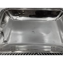 Early 20th century silver entree dish and cover, of rectangular form with shaped corners and oblique gadrooned borders to base and cover, the cover with loop 'bamboo' handle, hallmarked Thomas Bradbury & Sons Ltd, Sheffield 1930, including handle H10.5cm L24.5cm