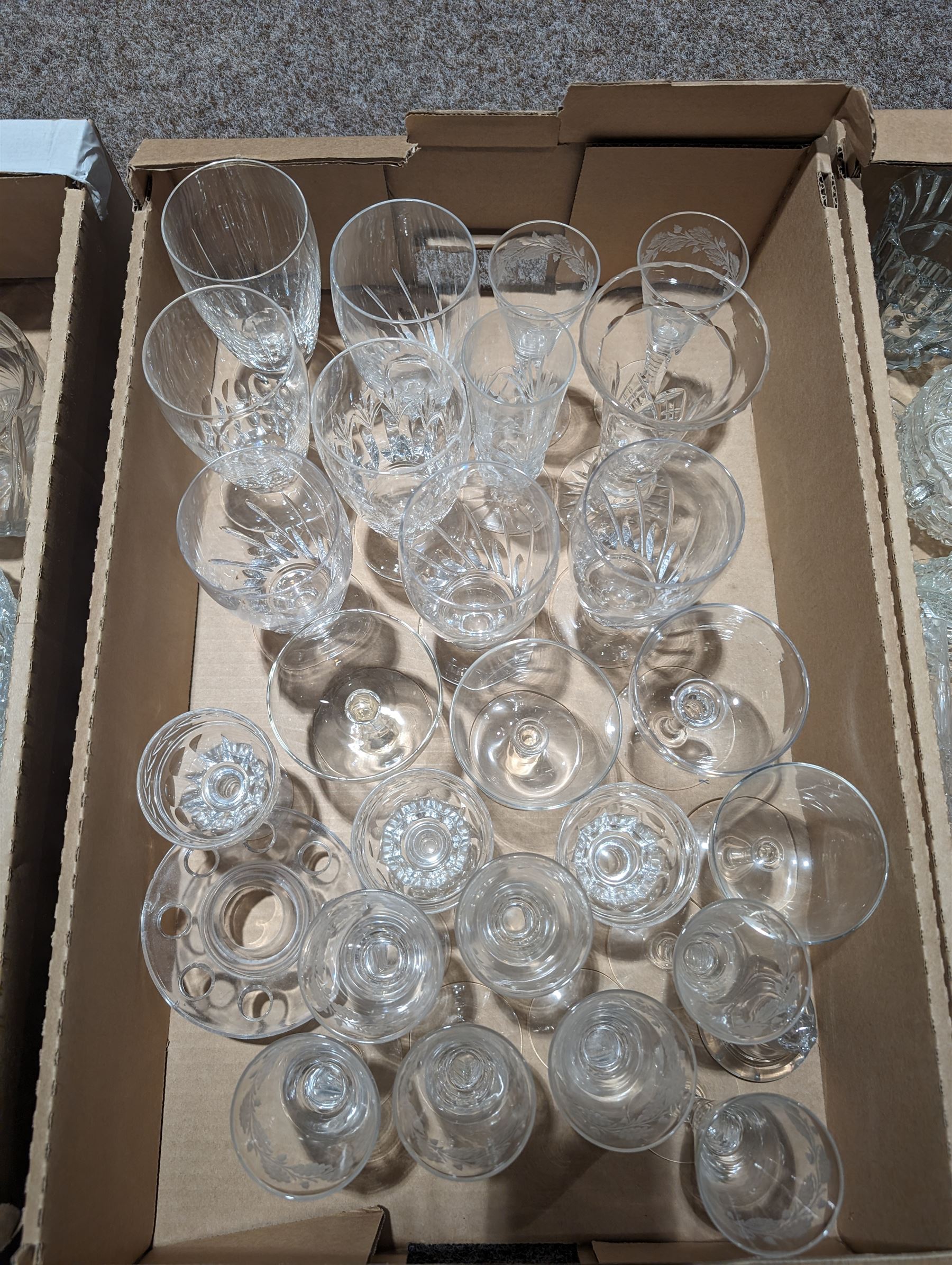 Stuart Crystal drinking glasses, including cut and etched examples, together with a collection of other cut glass and similar, including, decanters, vases, drinking glasses, jugs, etc