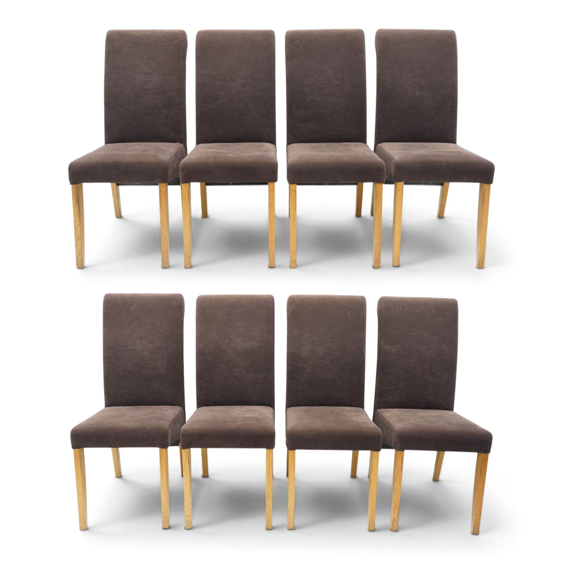 Modern solid oak extending dining table and eight upholstered chairs, the table of plank top construction raised on square supports, extended to 231cm with leaves 