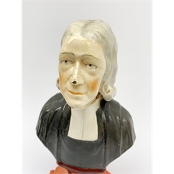 A Staffordshire bust, modelled as John Wesley, upon spreading base, H24.4cm.  