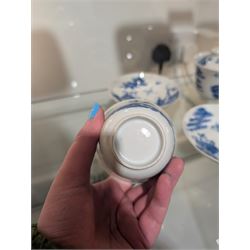Pair of Chinese blue and white tea bowls, one with cover and four saucers, depicting two figures on a boat at sea, tea bowl H7cm