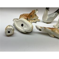 Group of Russian USSR animal figures by Lomonosov, to include examples modelled as an outstretched hunting fox, kitten, lion cubs, seagull/tern etc, all with stamped marks beneath, together with a model of a recumbent deer with no marks, tallest H14cm