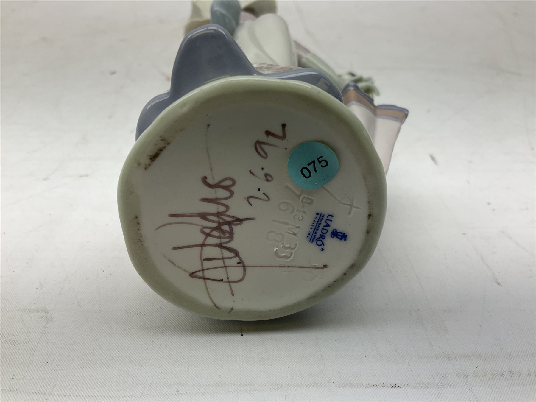 Two Lladro figures, comprising Garden Classic, no 7617 and Garden Song, no 7618, with original boxes and artists signature beneath, largest example H23cm