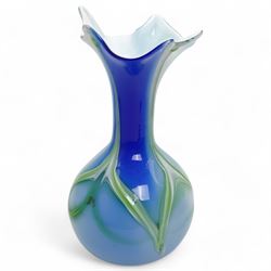 Art Nouveau style blue and white glass vase, of baluster form with elongated neck, the decorative green stems leading towards a petal shaped rim, H29cm; together with four similar art glass vases, tallest H36cm (5)