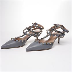 Valentino Garavani - pair of Rockstud grained leather and leather strap stiletto heels in blue, with pointed toes and gold tone pyramid stud detailing to the uppers, size 38, unused with original box and dust bag