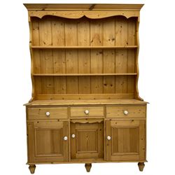 Traditional pine dresser, two heights plate rack over dresser base fitted with three drawers and three cupboards