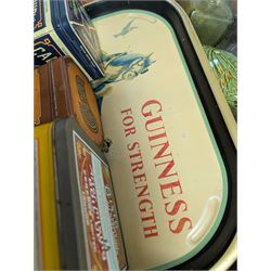 Collection of advertising tins, including Bisto and Cadburys, together with a Guinness 'For Strength' metal tray, brass measures, glass bottles, Royal Crown Derby cat paperweight, etc