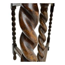 Early 20th century oak gateleg table, oval top with drop leaves supported by barley twist swing supports, united by plain stretchers, on turned feet (W119cm, D92cm, H77cm);