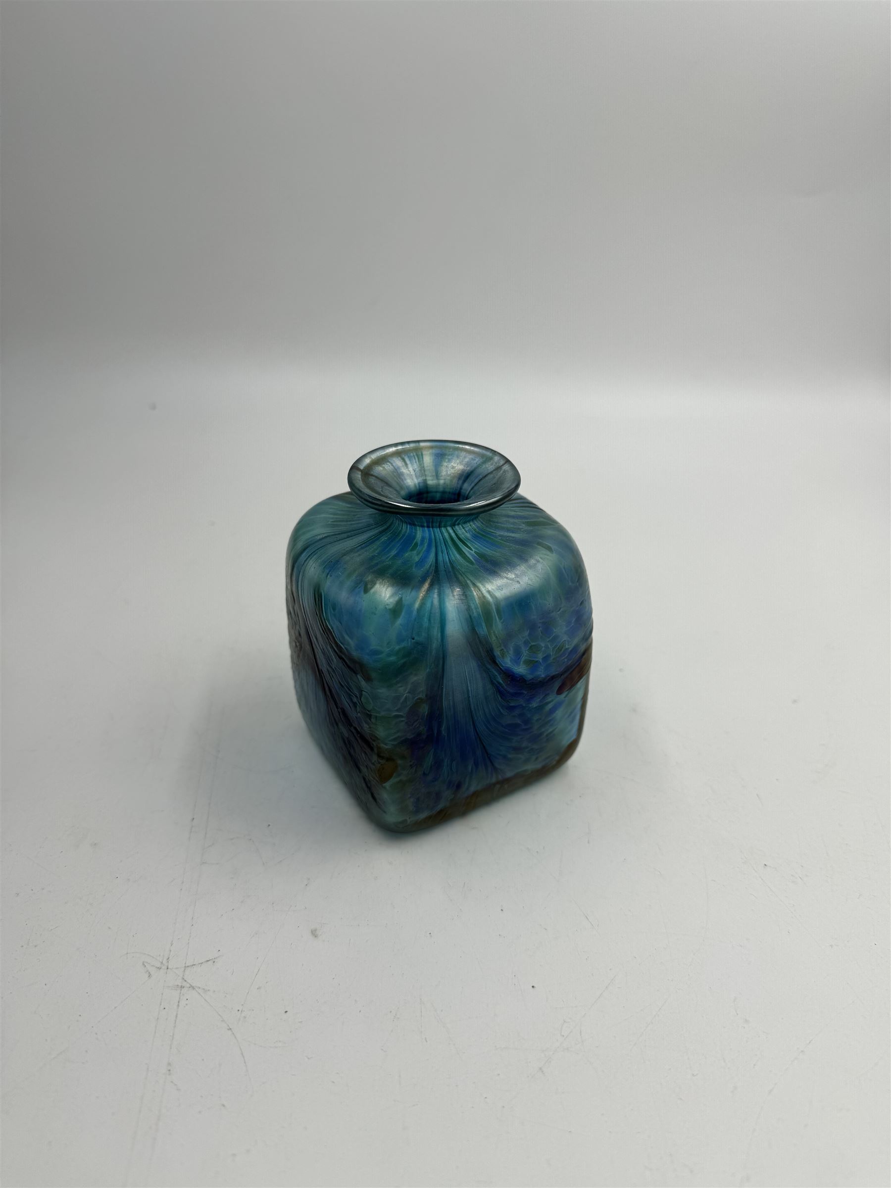 Robert Held glass vase, decorated with iridescent threads and pulls over a blue ground, together with glass vase of squat square form, tallest H10cm, both with original boxes 