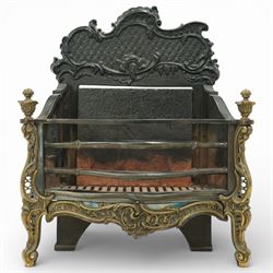 20th century Rococo style fire basket, cast iron back plate with pierced and scroll moulded cresting, steel fire bars and grate, ormolu mounted uprights with foliate scrollwork, on shaped feet