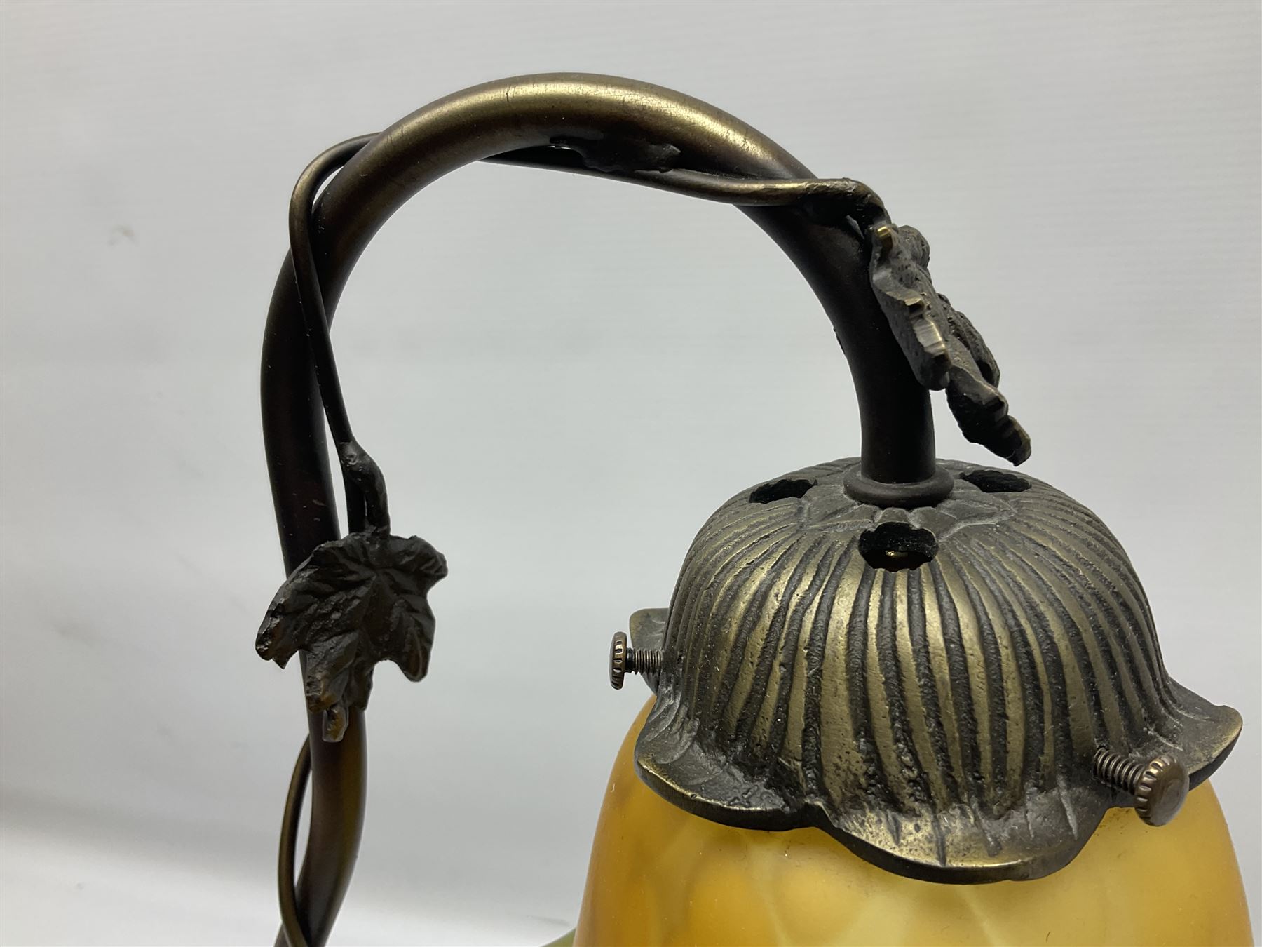 Art Nouveau style lamp in the form of a woman on a swing, with a green mottled shade, upon a marble base H52cm