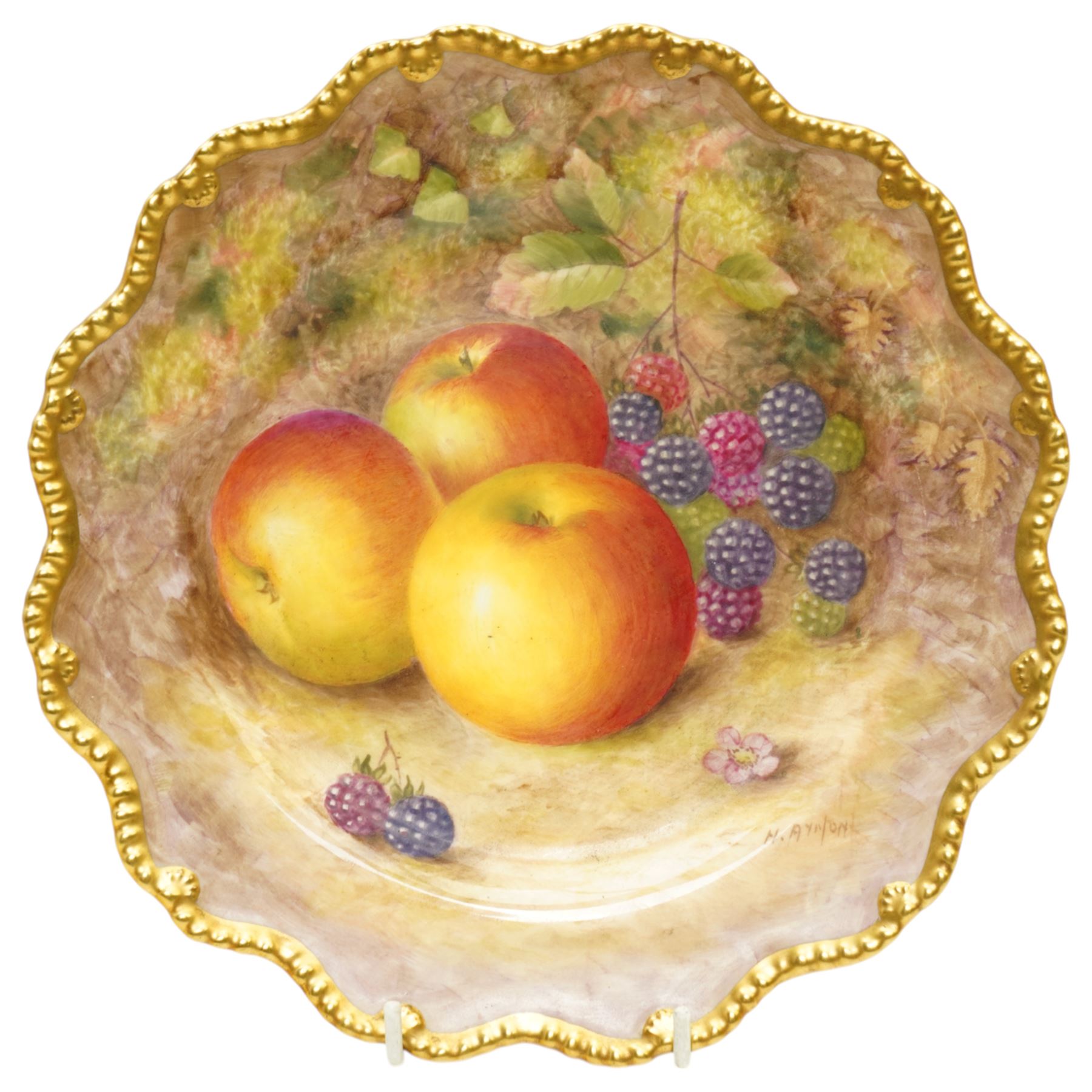 Royal Worcester porcelain cabinet plate by Harry Ayrton painted with fruit on a mossy bank within a shaped, gilded, gadrooned border, signed,  black printed mark and date code for 1949 D23cm
