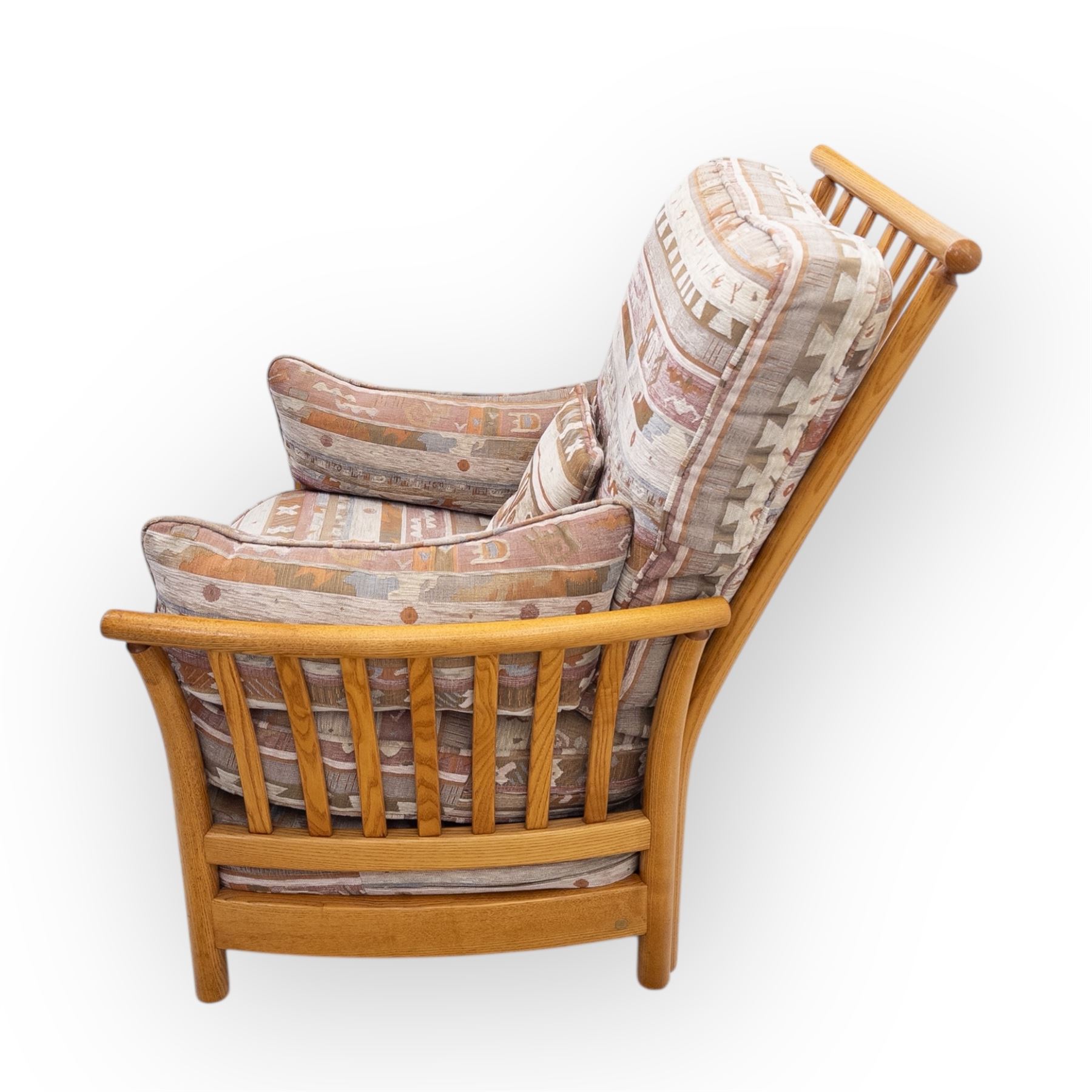 Ercol - Renaissance ash and elm high back armchair, upholstered in geometric Kilim patterned fabric with padded back, seat and arm cushions, curved stick back frame and turned supports