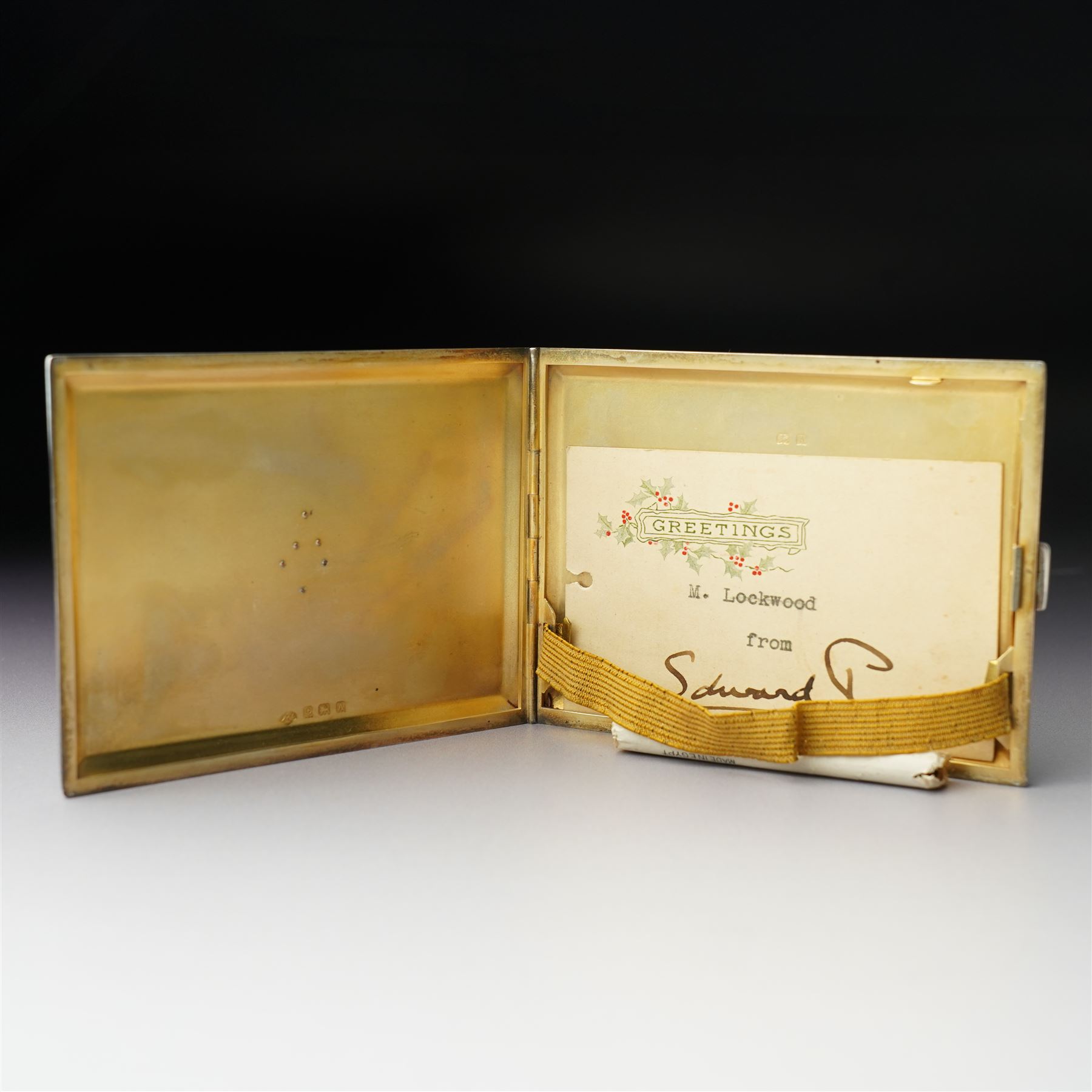 Royalty Interest - Engine turned silver cigarette case with gold crowned cypher, the gilded interior with a greetings card signed 'Edward' and an Egyptian cigarette 11cm x 8cm Birmingham 1925 Maker Adie Bros. Ltd in the original gilt tooled leather case marked 'Hartley, 45 Albemarle St., London'