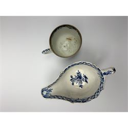 18th century Bow coffee cup, decorated in a version of the Mansfield pattern, circa 1760, H5.5cm, together with an 18th century blue and white cream boat, probably Bow, decorated with floral sprays and sprigs, L14cm