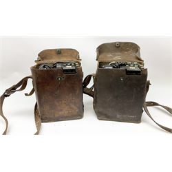 Two US signal Corps (US army) WWII era field telephones, both complete in brown leather cases, Model E-E-8-A. 