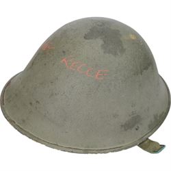Two gas masks, together with a green tin helmet, cased within a wooden box with hinged lid 