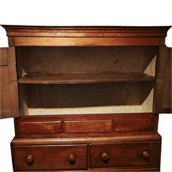 18th century oak larder cupboard, projecting moulded cornice over two panelled doors with shaped arched fielded panels, three short dummy drawers above base fitted with two short and one long drawer, turned handles, on bracket feet