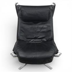 Pair of modernist black leather and chrome armchairs, in the manner of  Vatne Møbler, black leather sling seats suspended within chromed steel brackets, supported by polished chrome cross bases