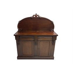 Victorian mahogany chiffonier sideboard, raised back with central cartouche pediment, fitted with two two drawers over two panelled cupboards, flanked by foliate corbels