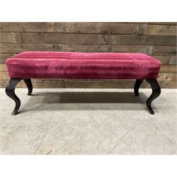 Large rectangular footstool upholstered in a maroon fabric with cabriole supports