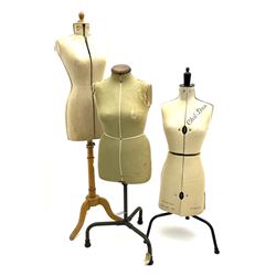 Three dress makers mannequins, to include one adjustable, tripod supports