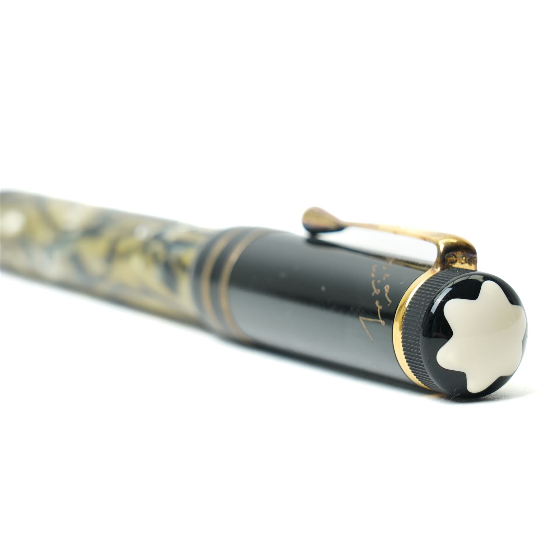 Montblanc Meisterstück Oscar Wilde limited edition fountain pen, black resin cap and barrel with marbled ivory and black patterned lower barrel and gold-plated fittings, the cap signed with Oscar Wilde facsimile and surmounted by the white star emblem, fitted with a medium 18K (750) gold nib engraved 4810, 1994 and MONTBLANC, model no. 28616, presented in original lined fitted case in the form of a book with outer box