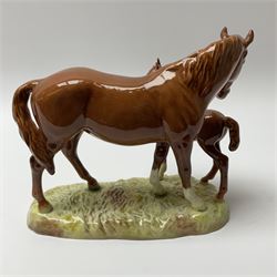 A Beswick model of a chestnut mare and foal on naturalistic base, 2nd version model no 953, with printed mark beneath, H19.5cm. 