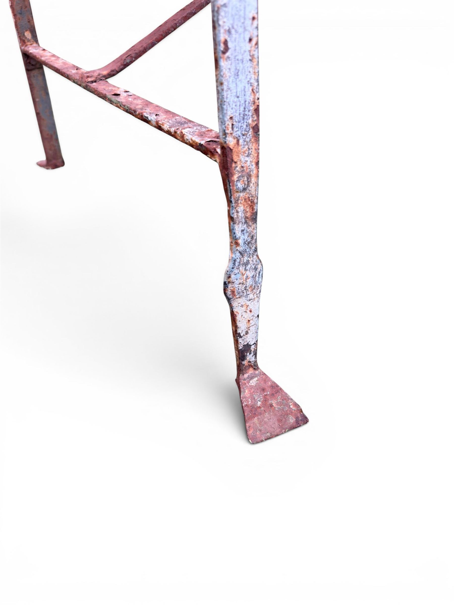 Regency period wrought iron strapwork garden bench, cresting rail with central Scottish thistle motif and flanking pediments, in distressed blue painted finish