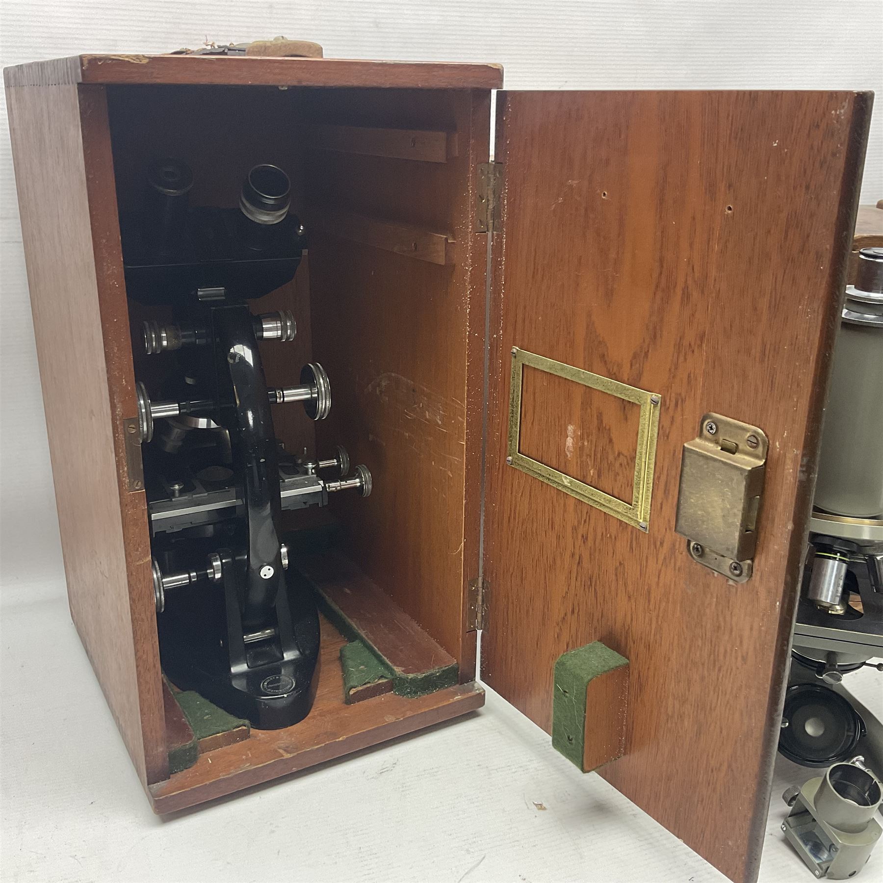 Four microscopes, including Cooke, Troughton & Simms no M467926, W Watson & Sons no 114758, W & J George & Beck Ltd no 36649 and one other 